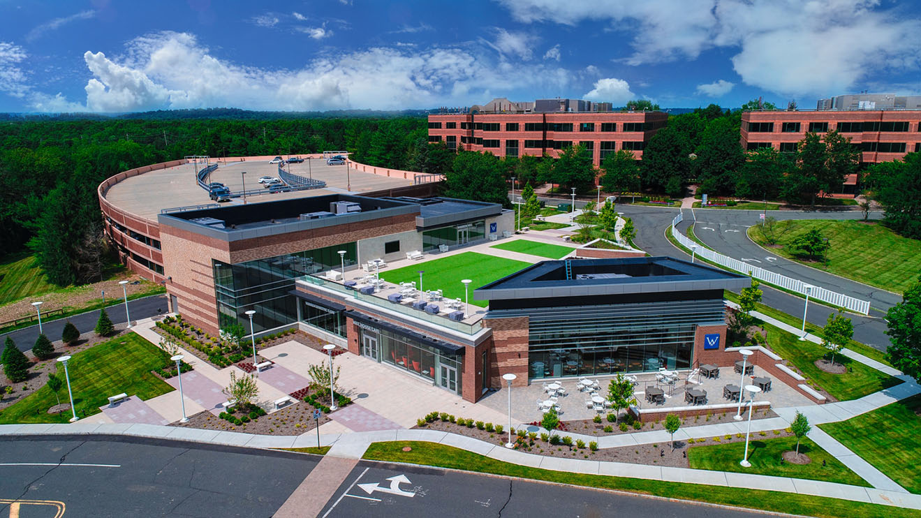 Birds eye view of a corporate office complex with rooftop amenity space between buildings