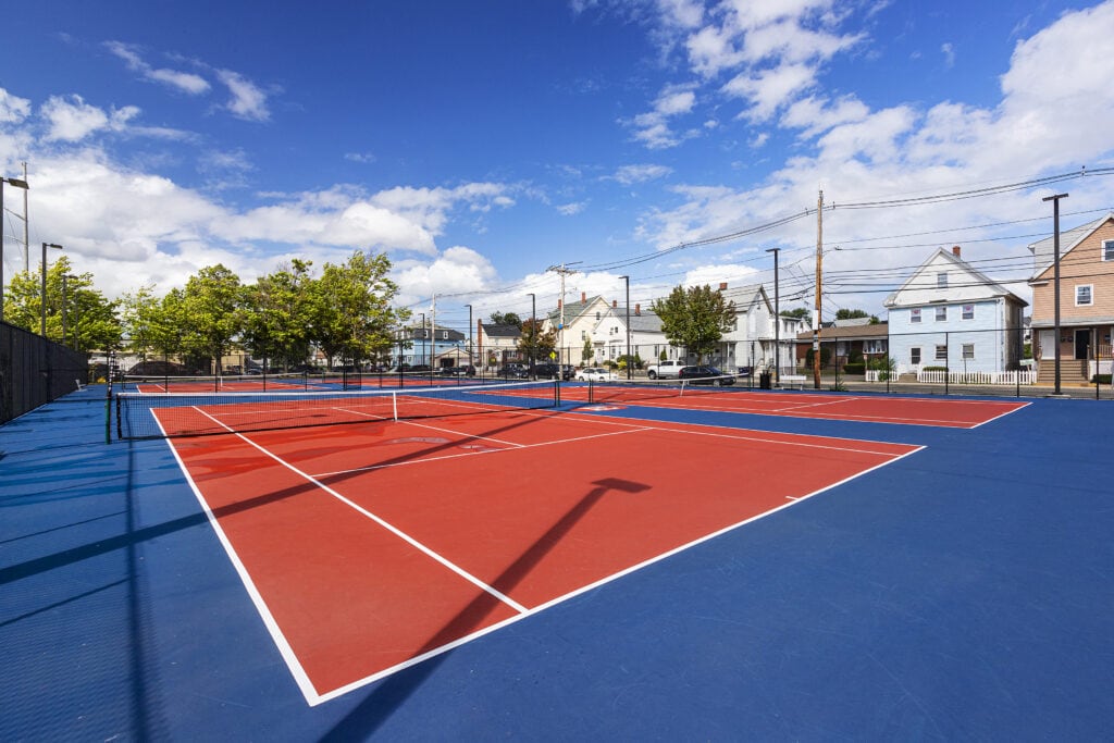 The park features four USTA tennis courts with wifi controlled lighting and a pickleball court