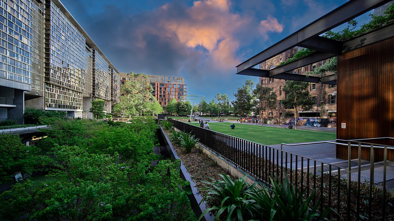 Apartment block in Sydney NSW Australia with hanging gardens and plants on exterior of the building at Sunset with lovely colourful clouds in the sky