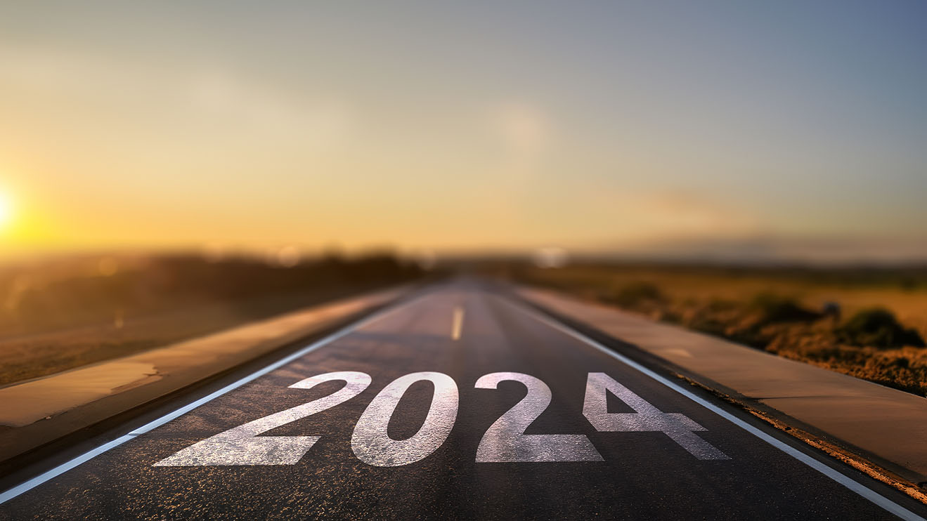 empty street with the new year 2024 written on the road