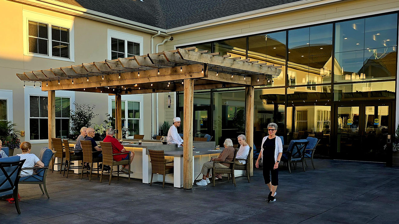 A group of seniors enjoying an outdoor dining facility