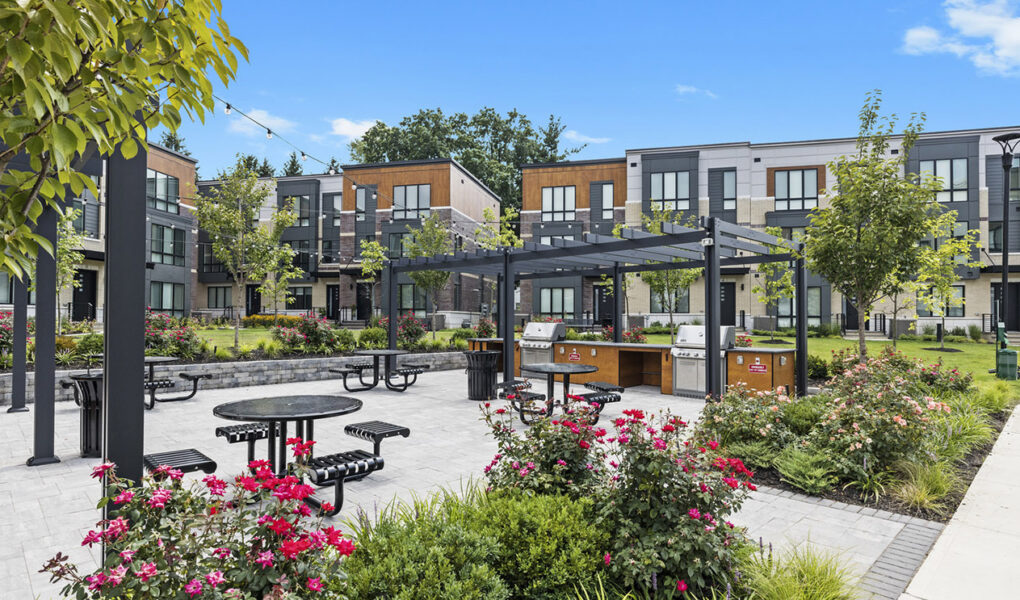 Beautiful outdoor amenity space, outdoor kitchen, grilling station, flowers and plantings, outdoor patio